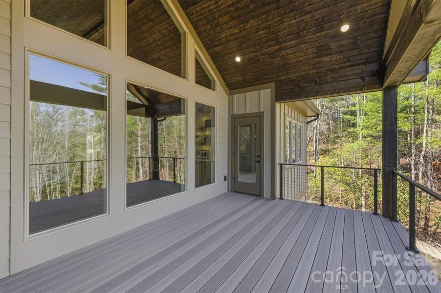Here is a different look towards the house. The door across the deck provides access to the owners' suite bedroom so we will head there next. Here is a different look towards the house. The door across the deck provides access to the owners' suite bedroom so we will head there next.