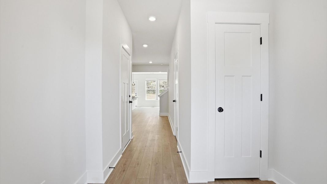 Established style and superior craftsmanship evident from the hardwood foyer entry at the new Marion Square community