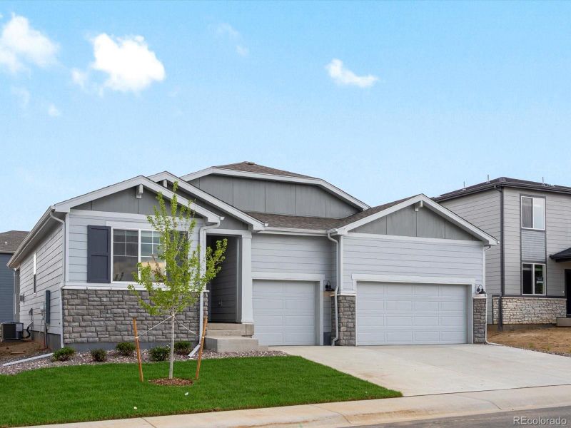 Front exterior of a new home in Poudre Heights: The Alpine Collection, Windsor, CO, highlighting curb appeal (Image 2).