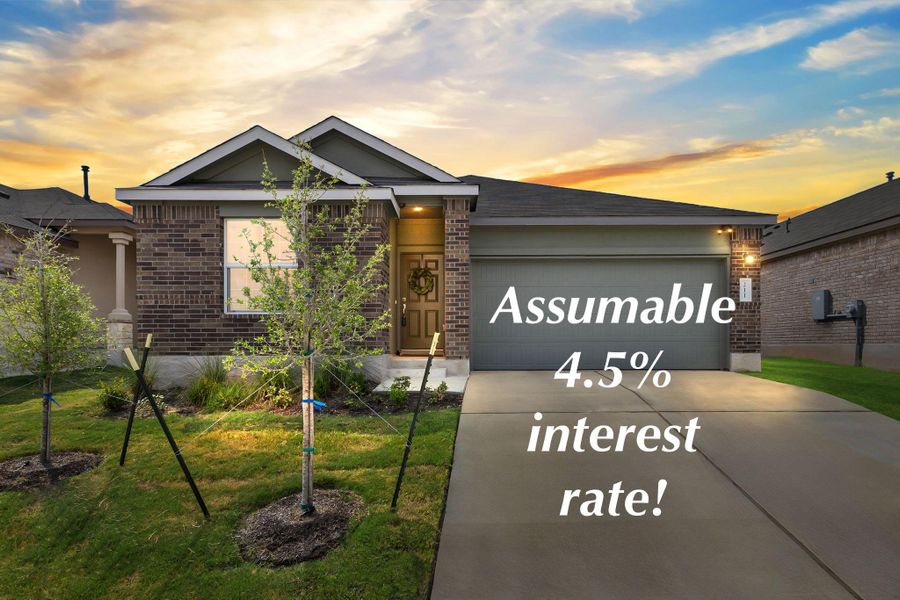 brick siding, concrete driveway, a front yard, and a garage brick siding, concrete driveway, a front yard, and a garage