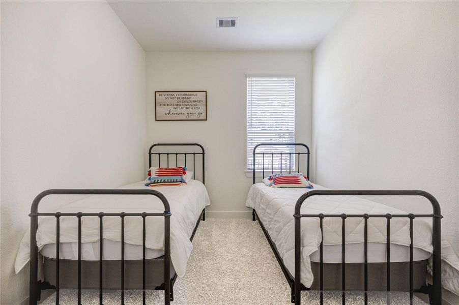 Secondary bedroom filled with natural light and a warm, welcoming feel. Secondary bedroom filled with natural light and a warm, welcoming feel.