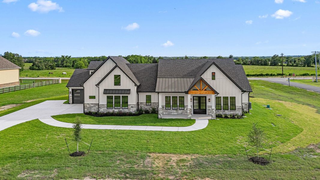 Front exterior of a new home in , Bellville, TX, highlighting curb appeal (Image 26).