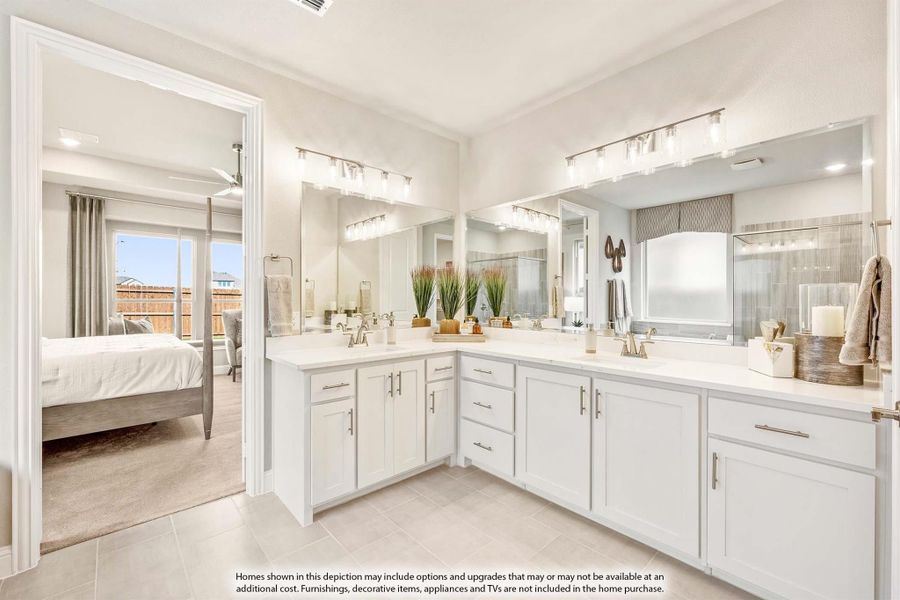 Master bathroom with dual vanities, white cabinets, large mirrors, and tile floors, open to bedroom Master bathroom with dual vanities, white cabinets, large mirrors, and tile floors, open to bedroom