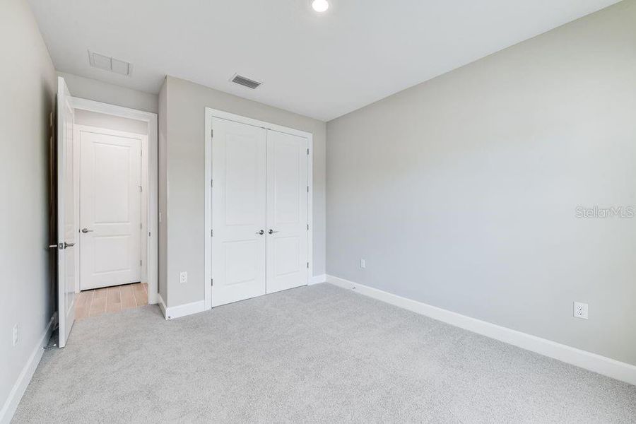 Spacious, unfurnished interior of a new home in Esplanade at Skye Ranch, Sarasota (Image 19).