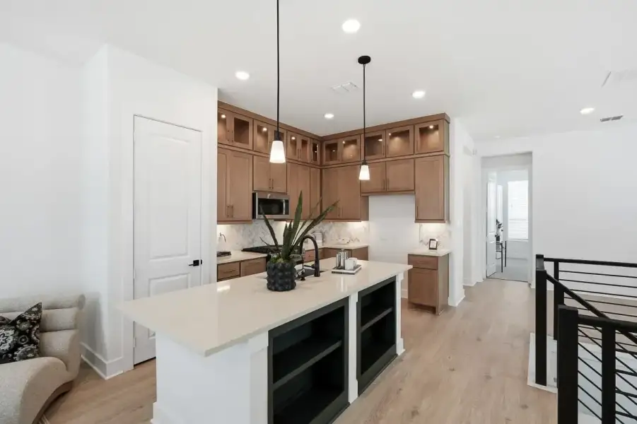 Representative furnished interior of a home built from the Calypso by Chesmar Homes in Centero at Stone Oak, San Antonio (Image 6).