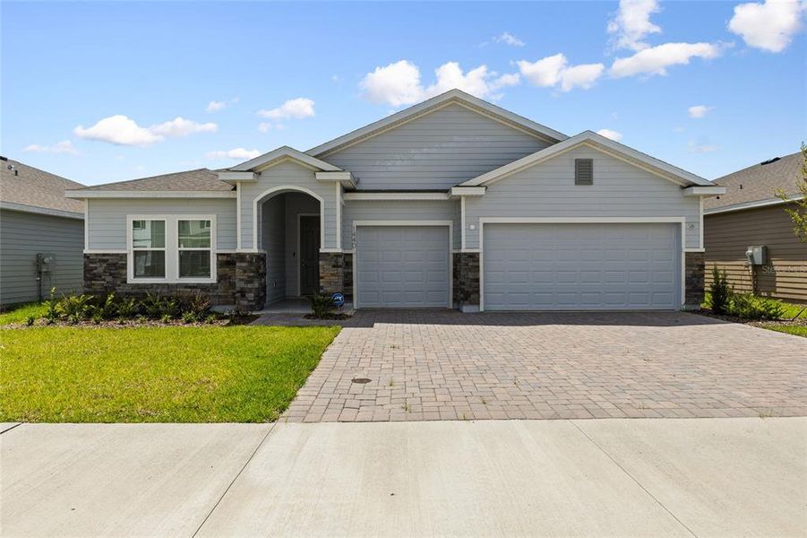 Front exterior of a new home in , Newberry, FL, highlighting curb appeal (Image 26).