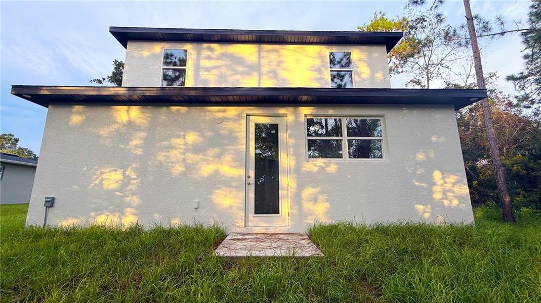 Front exterior of a new home in , St. Cloud, FL, highlighting curb appeal (Image 15). Front exterior of a new home in , St. Cloud, FL, highlighting curb appeal (Image 15).
