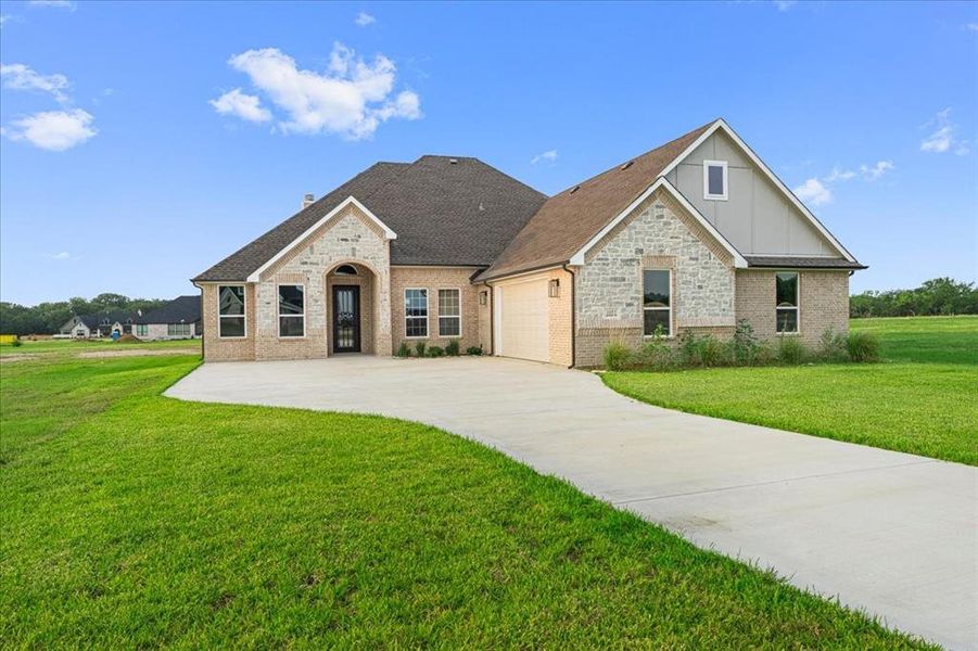 Front exterior of a new home in , Corsicana, TX, highlighting curb appeal (Image 20). Front exterior of a new home in , Corsicana, TX, highlighting curb appeal (Image 20).