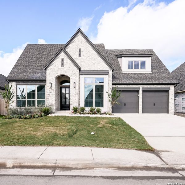 Front exterior of a new home in Meadows of Mill Creek, Seguin, TX, highlighting curb appeal (Image 20). Front exterior of a new home in Meadows of Mill Creek, Seguin, TX, highlighting curb appeal (Image 20).