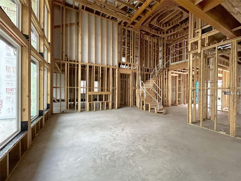 Living Area That Features High Ceilings, Tons of Natural Light, and An Electric Fireplace. Construction Photo as of 3/13/2026 Living Area That Features High Ceilings, Tons of Natural Light, and An Electric Fireplace. Construction Photo as of 3/13/2026