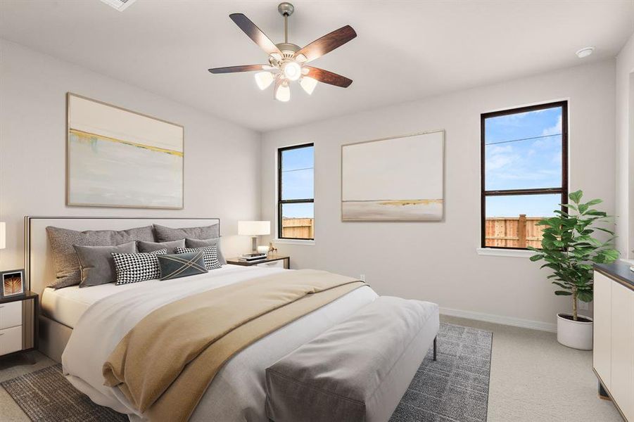 The primary bedroom is generously sized, creating a tranquil and spacious retreat that offers ample room for relaxation. Featuring plush carpet, high ceilings, fresh paint, and large windows that lets in natural lighting throughout the day.