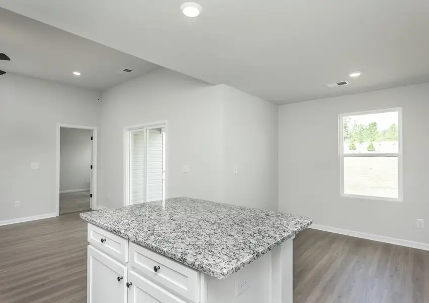 The kitchen overlooks the living area