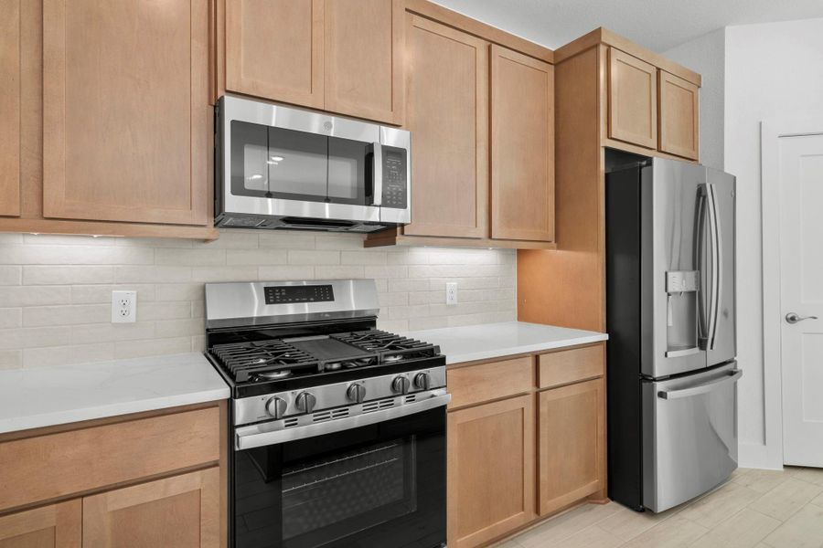 Furnished interior view inside a new home in Meridiana, Iowa Colony (Image 9).
