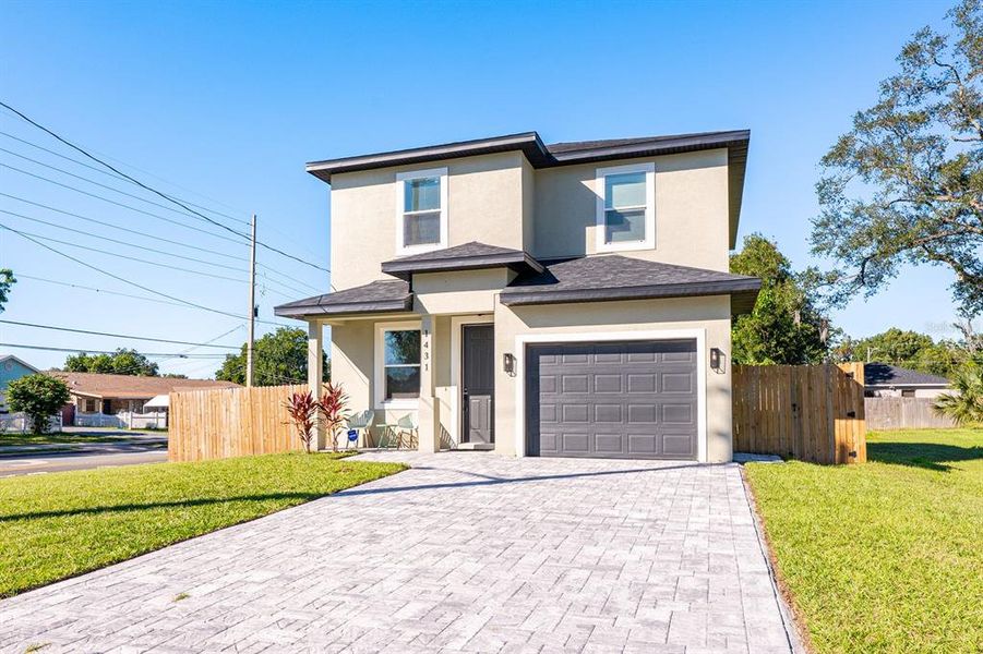 Front exterior of a new home in , Orlando, FL, highlighting curb appeal (Image 2). Front exterior of a new home in , Orlando, FL, highlighting curb appeal (Image 2).