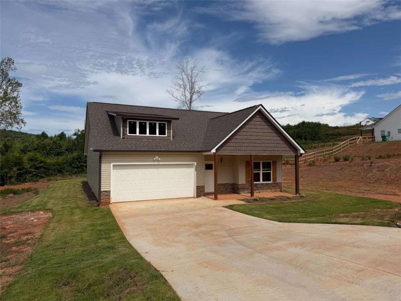 Front exterior of a new home in , Eastanollee, GA, highlighting curb appeal (Image 1). Front exterior of a new home in , Eastanollee, GA, highlighting curb appeal (Image 1).