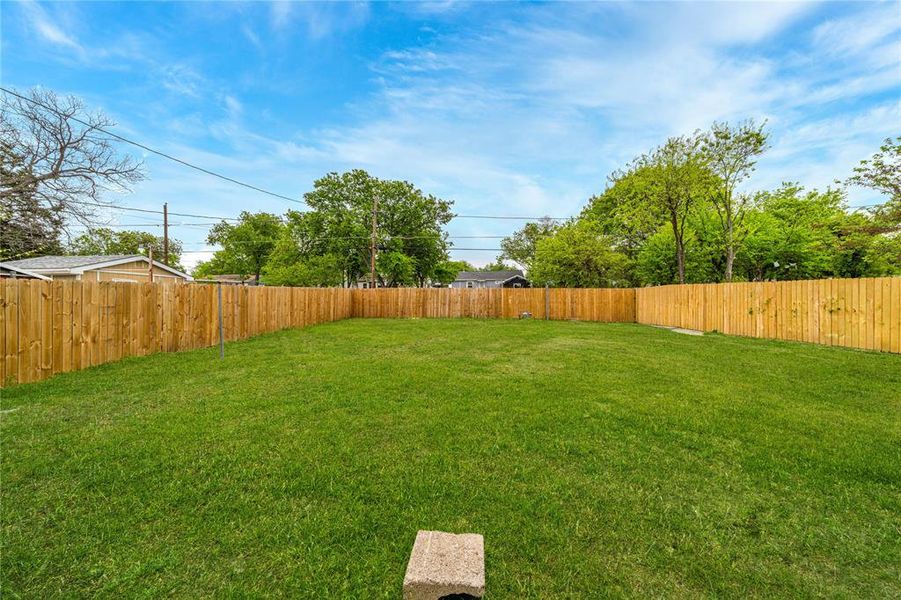 View of fenced backyard