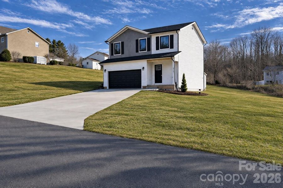 Front exterior of a new home in , Hudson, NC, highlighting curb appeal (Image 1). Front exterior of a new home in , Hudson, NC, highlighting curb appeal (Image 1).