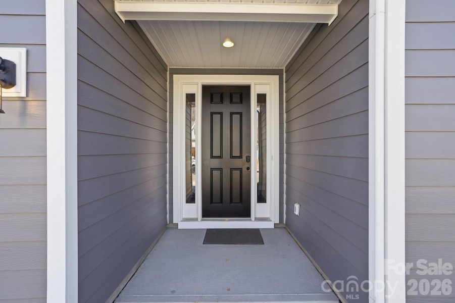 Exterior details and patio area of a home in Villas at Prestwick, Mooresville (Image 3).