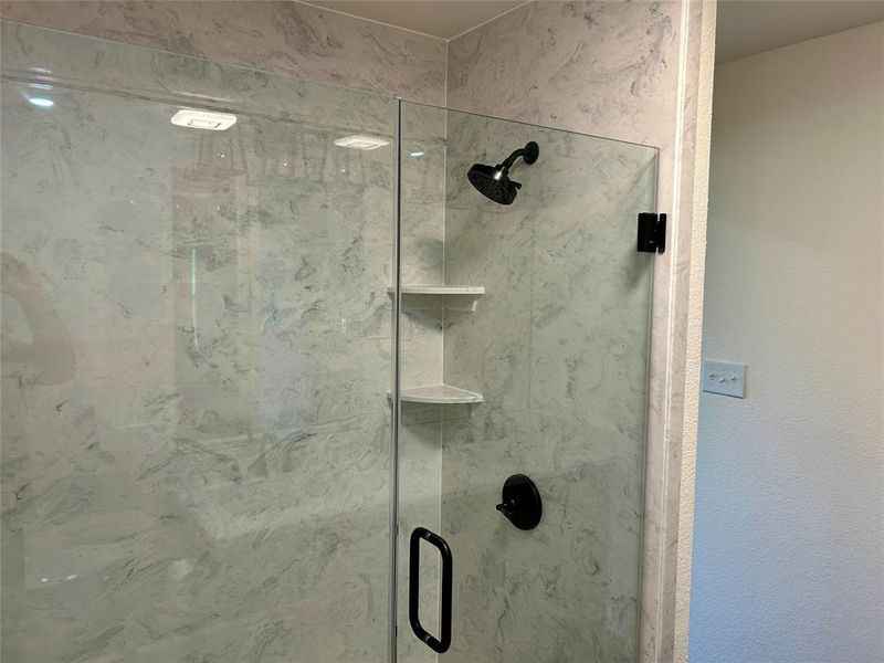 Bathroom view of a marble finish shower