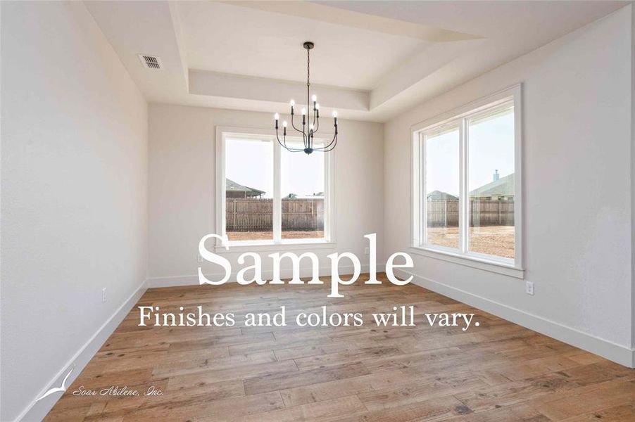 spacious dining room with large windows providing ample natural light. spacious dining room with large windows providing ample natural light.