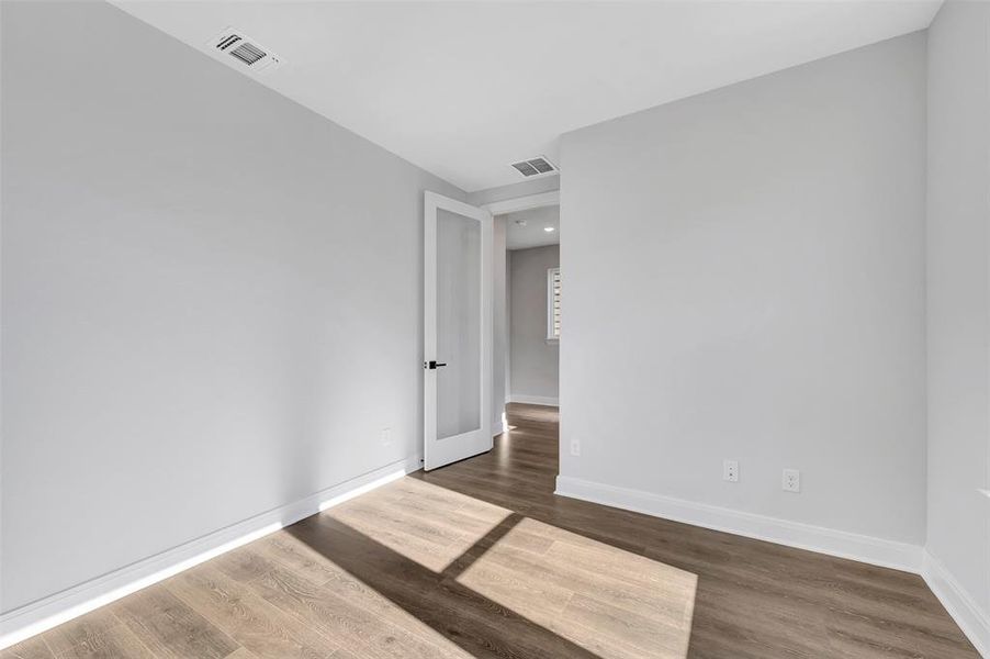 Spacious, unfurnished interior of a new home in Painted Tree Woodland West – Cottages, McKinney (Image 27).