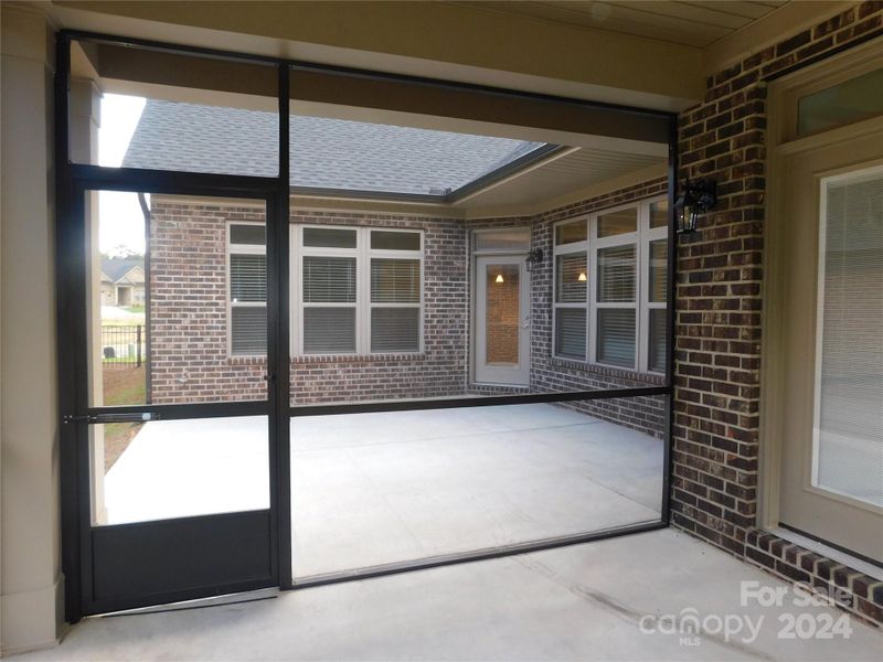 Screened Porch looking out to Large Private Patio