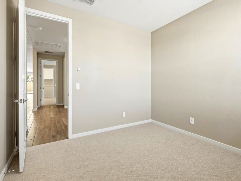 Spacious, unfurnished interior of a new home in White Tank Foothills Signature Series, Waddell (Image 21).