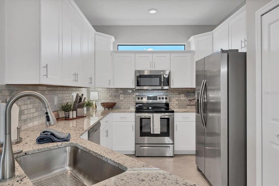 Furnished interior view inside a new home in , Port Charlotte (Image 22).