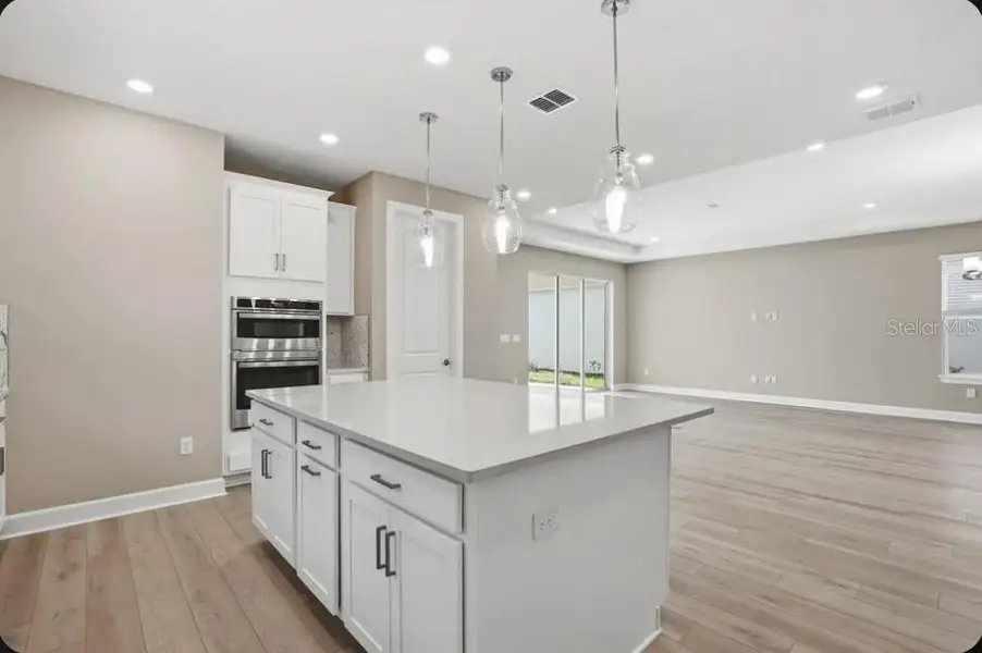 Furnished interior view inside a new home in Coasterra Community Group Page, Palmetto (Image 8).