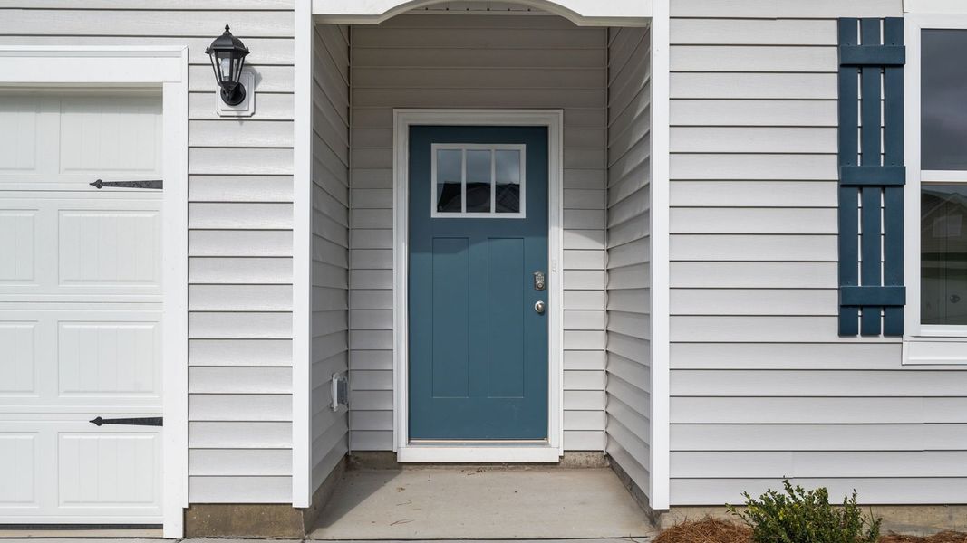 Exterior details and patio area of a home in East Ridge, Ayden (Image 3).