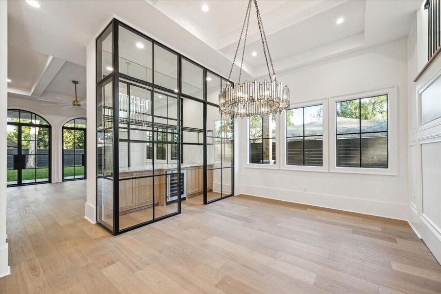 Elegant formal dining room with wine room.*Picture is of a recently constructed home by the builder.  1519 Candlelight will be similar in quality, but these pictures are not meant to be an exact representation of the new home. Specs of home may change at sole discretion of the seller.