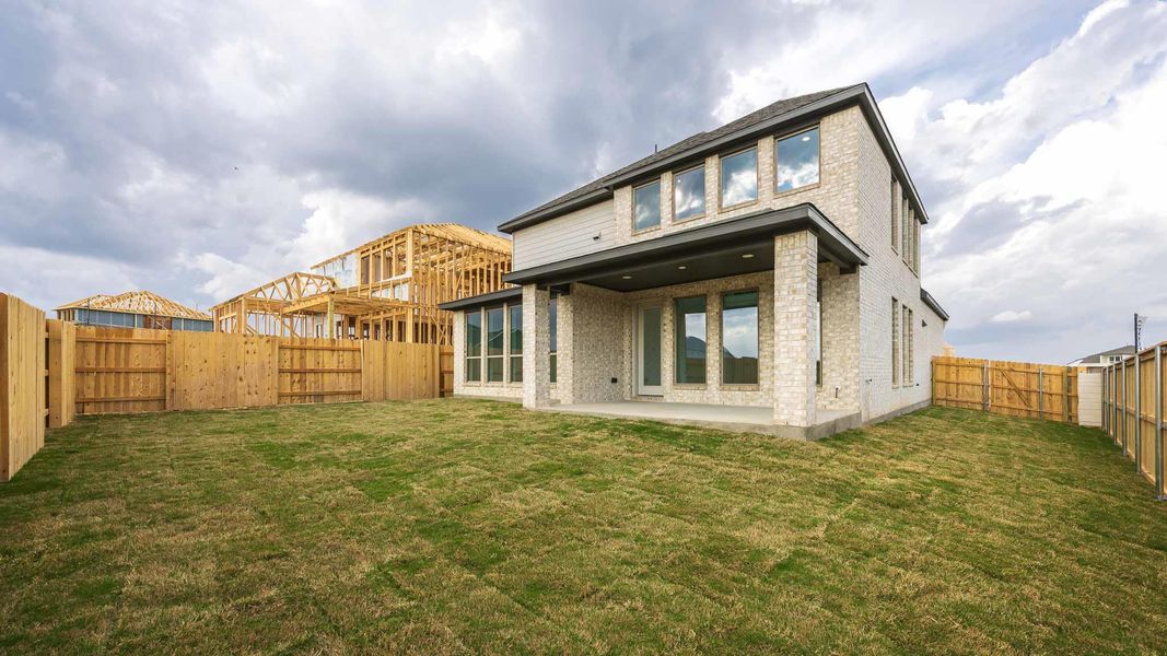Exterior details and patio area of a home in Lariat 45', Liberty Hill (Image 3).