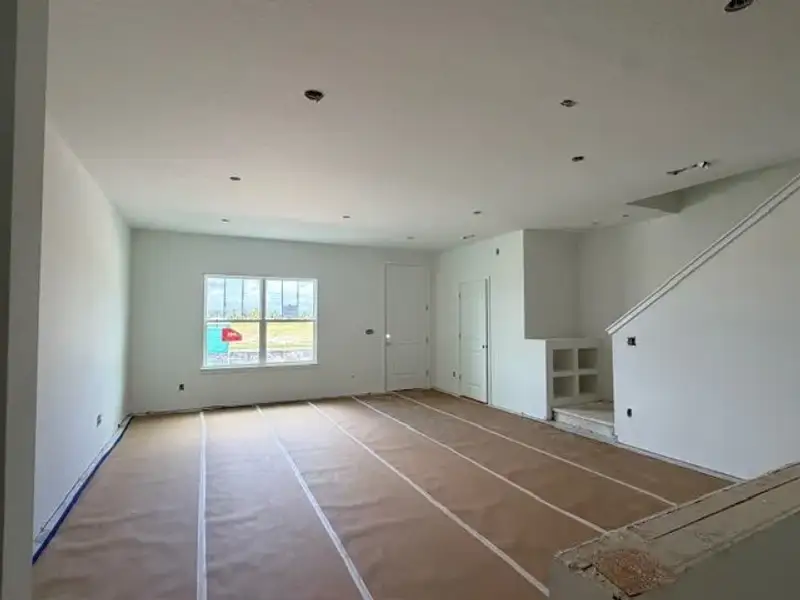 In-progress construction of a new home in Whaley Grove Townhomes, St. Cloud, FL (Image 13).