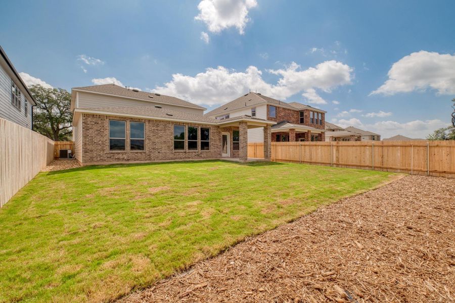 Front exterior of a new home in River Bluff, Leander, TX, highlighting curb appeal (Image 17).