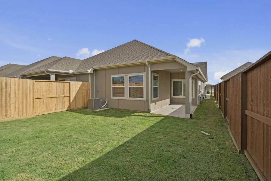 Representative exterior details of a home built from the Carriagehouse by Chesmar Homes in Meridiana Townhomes, Iowa Colony (Image 46).