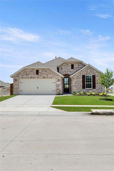 Front exterior of a new home in Walden Pond, Forney, TX, highlighting curb appeal (Image 1).