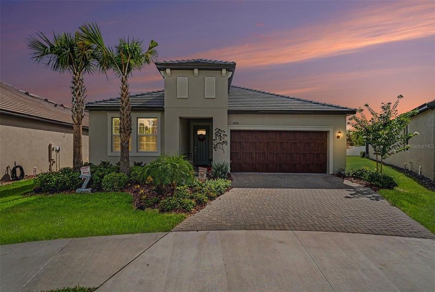 Front exterior of a new home in Angeline Active Adult, Land O' Lakes, FL, highlighting curb appeal (Image 2). Front exterior of a new home in Angeline Active Adult, Land O' Lakes, FL, highlighting curb appeal (Image 2).