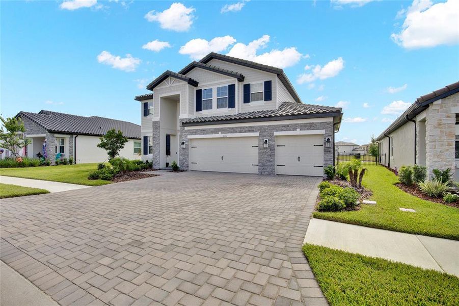 Front exterior of a new home in , Wesley Chapel, FL, highlighting curb appeal (Image 27).