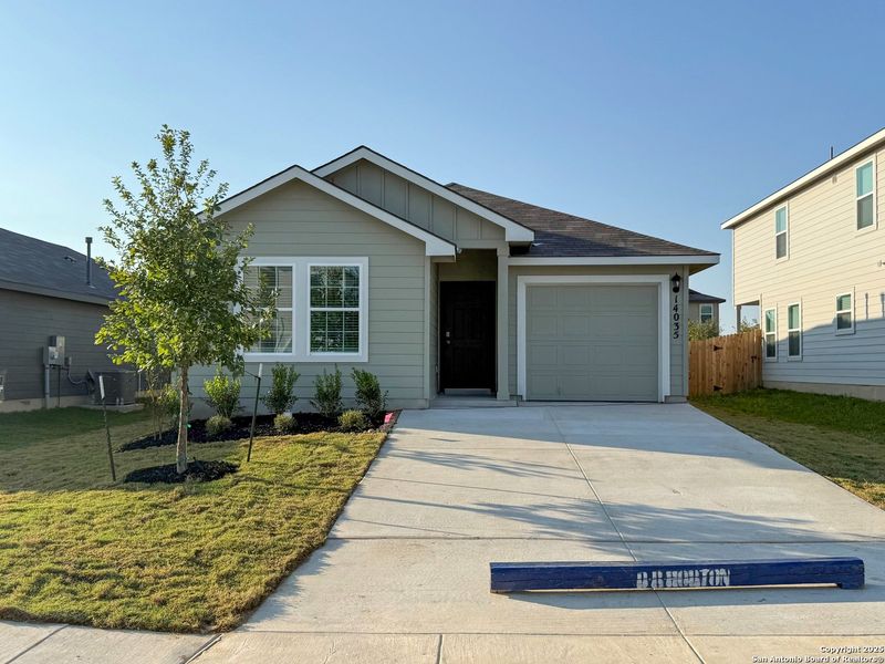 Front exterior of a new home in Riverstone at Westpointe, San Antonio, TX, highlighting curb appeal (Image 1).