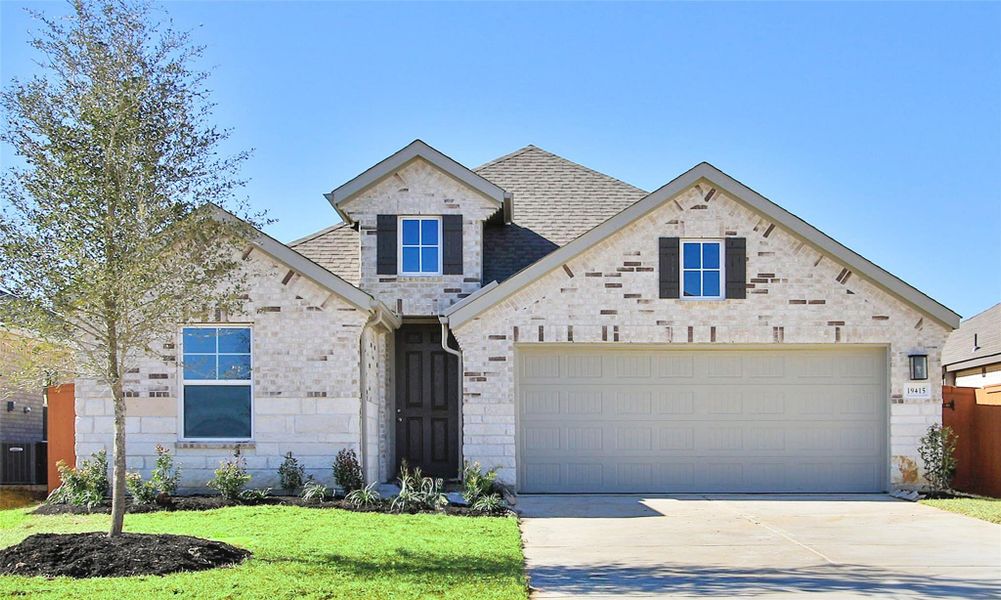 Front exterior of a new home in Cypress Green, Hockley, TX, highlighting curb appeal (Image 1). Front exterior of a new home in Cypress Green, Hockley, TX, highlighting curb appeal (Image 1).