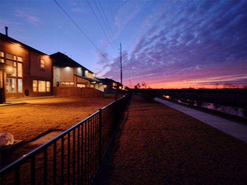 Private backyard retreat with scenic walking trail & water views-no back neighbors.
