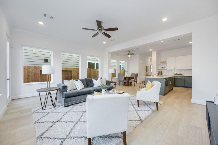 So Much Space to Relax & EntertainThis wide-angle view shows off the magic of first-floor living—kitchen, dining, and living all connected in one beautifully cohesive space.