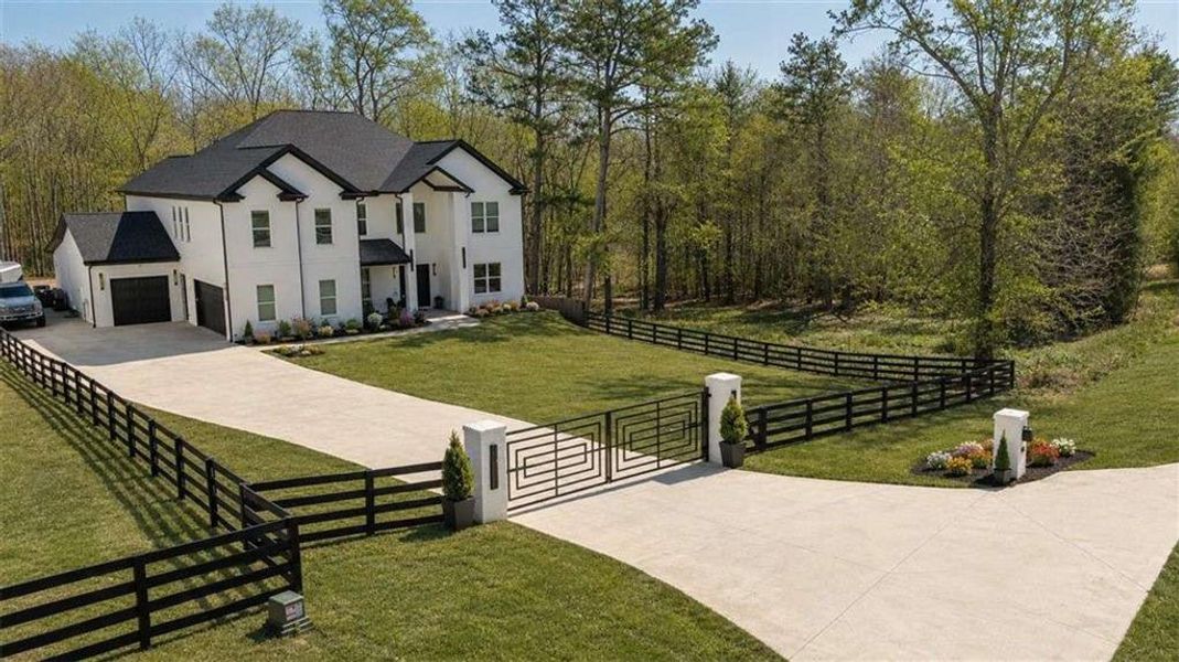 Front exterior of a new home in , Hoschton, GA, highlighting curb appeal (Image 24).