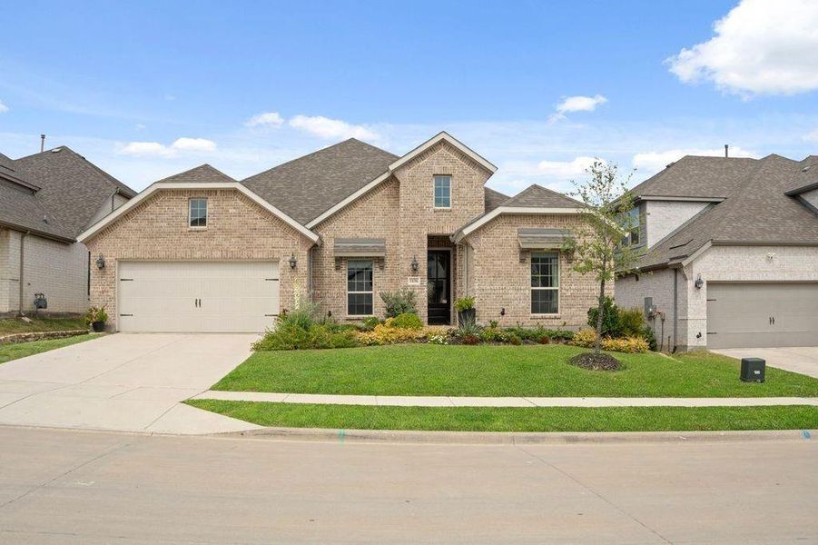 Front exterior of a new home in , Prosper, TX, highlighting curb appeal (Image 1).