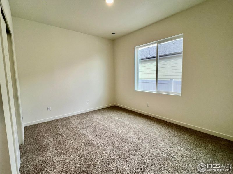 Spacious, unfurnished interior of a new home in Union Colony West, Greeley (Image 17).