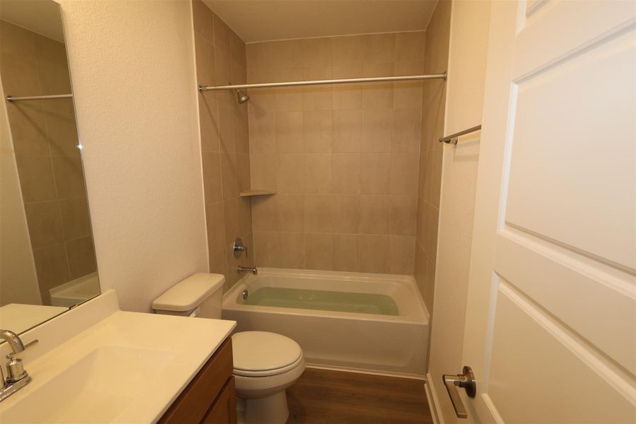 Furnished interior view inside a new home in Lone Star Landing, Montgomery (Image 7).