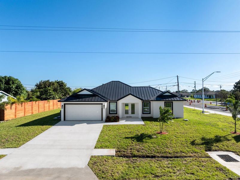 Front exterior of a new home in , Port St. Lucie, FL, highlighting curb appeal (Image 18). Front exterior of a new home in , Port St. Lucie, FL, highlighting curb appeal (Image 18).