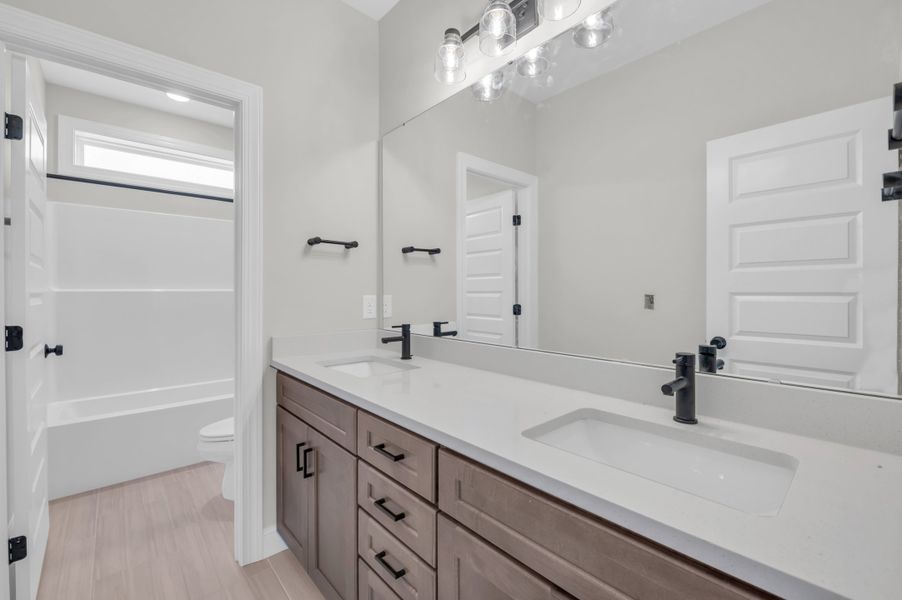 Representative furnished interior of a home built from the The Whitley by RobuckHomes in Windwater, Hampstead (Image 65).