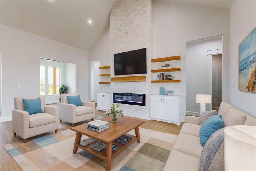 Living room featuring a stone fireplace, light hardwood / wood-style floors, and high vaulted ceiling