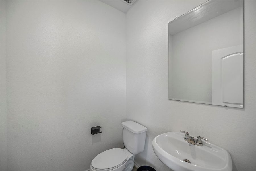Convenient half bath just off the front entry Convenient half bath just off the front entry